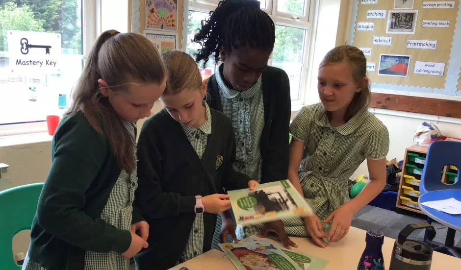 Photo of school children partaking in a workshop.